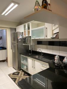 Η κουζίνα ή μικρή κουζίνα στο Apartamento Centro Araranguá +5 φωτογραφίες