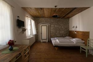 Posteľ alebo postele v izbe v ubytovaní Plitzner Belvárosi Apartmanház