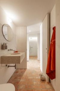 a bathroom with a sink and a mirror at Danna Portuguese Design House Porta 10 in Tavira