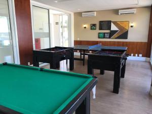 three billiard tables in a room with at Beach Living, Frente mar, Vizinho B Park - Oficial in Mangabeira