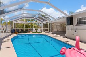 an image of a swimming pool in a house at Doral Beach in Tampa