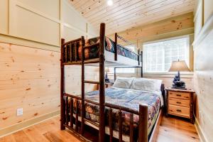 a bedroom with a bunk bed in a cabin at Less Than 5 Mi to Whiteface Mtn Resort Cabin-Style Apt in Wilmington