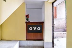 a sign on the door of a building at Hotel O Sonali Guest house in Tangra