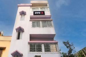 a white building with a yes sign on it at Hotel O Sonali Guest house in Tangra