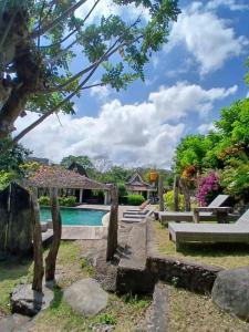 a view of the pool at the villa at One More Wave Surf House Uluwatu in Uluwatu