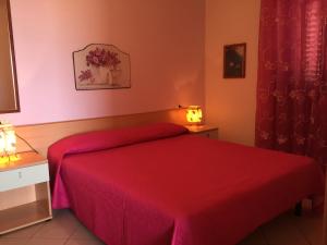 A bed or beds in a room at Villa Marilena