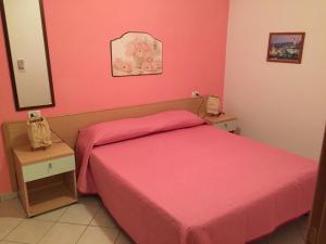A bed or beds in a room at Villa Marilena