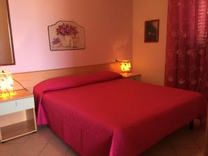 A bed or beds in a room at Villa Marilena
