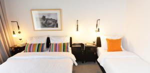Voodi või voodid majutusasutuse The Loop Hotel toas
