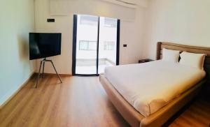 Postel nebo postele na pokoji v ubytování Magnifique appartement à Founty Agadir