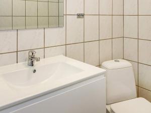 a bathroom with a white sink and a toilet at 6 person holiday home in Hadsund-By Traum in Hadsund +26 photos