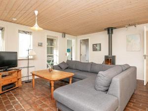 A television and/or entertainment centre at 8 person holiday home in Ulfborg-By Traum