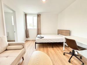 a living room with a bed and a desk at Double Beds Room with Private Bathroom in Los Angeles
