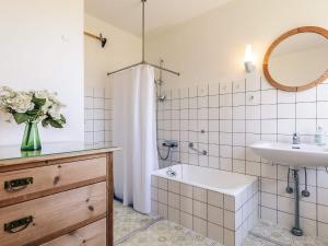 a bathroom with a sink and a toilet and a tub at 8 person holiday home in Harpelunde in Harpelunde +40 photos