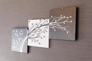two cards on a wall with a painting of a plant at G71 駅徒歩3分 クールでおしゃれ4人可 名古屋駅1駅 Wi-Fi無料 3min walk from metro Wi-Fi Free in Nagoya