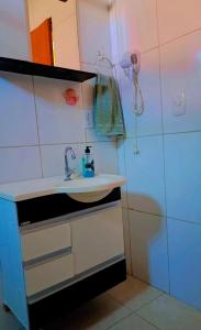 a bathroom with a sink and a shower at Escapada do Sonho in Lençóis +15 photos