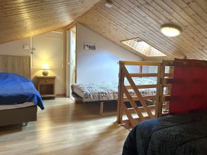 a bedroom with a bed and a ladder in a room at Mais 5 pièces 8 couchages SAINT HILAIRE DE RIEZ - FR-1-224-822 in Saint-Hilaire-de-Riez