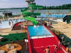 a pool with a water park with a water slide at Appartement charmant au cœur de Vesoul avec parking privé - FR-1-583-509 in Vesoul