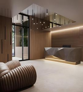 a lobby with a chair and a reception desk at Skylux 702 in Rio de Janeiro