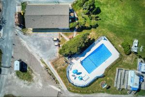 an overhead view of a swimming pool next to a house at RV by the Sea in North Topsail Beach