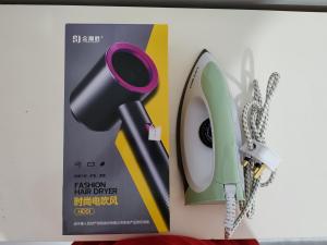 a picture of a hair dryer next to a box at Tracy Homestay Tmn Indah Jaya in Sandakan