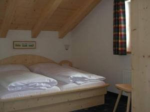 a bedroom with two beds in a room at Chalet in Königsleiten near Ski Lift in Wald im Pinzgau