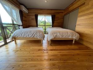 Ένα ή περισσότερα κρεβάτια σε δωμάτιο στο 湯布院 温泉付きの貸切別荘 無料Wi-Fi 無料駐車場