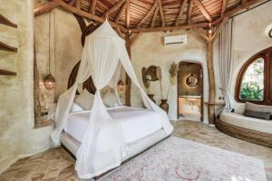 Ένα ή περισσότερα κρεβάτια σε δωμάτιο στο Nuanu Suites & Accommodations