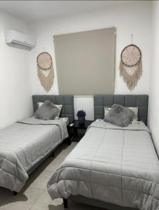 Ένα ή περισσότερα κρεβάτια σε δωμάτιο στο Haven de descanso y relajación