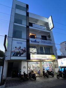 a group of motorcycles parked in front of a building at Blue Horizon Apartments in Trincomalee