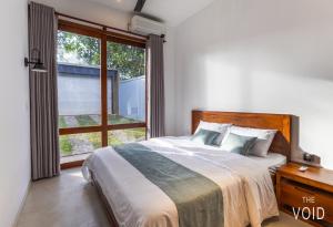 Una cama o camas en una habitación de The Void 5 Bedroom Luxury Villa for 10 Guests