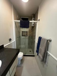 a bathroom with a glass shower and a toilet at Copacabana Front beach 2 in Rio de Janeiro
