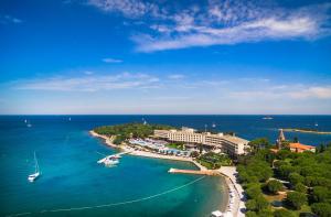 an aerial view of a beach with a resort and the ocean at Maistra Select Island Hotel Istra in Rovinj