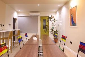 a conference room with a long table and chairs at Palette Room, Design House in Lekki +1 photo