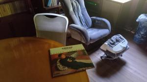 a book sitting on a table next to a chair at iorimokkou in Ogawa