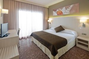 Postel nebo postele na pokoji v ubytování GHT Costa Brava & Spa