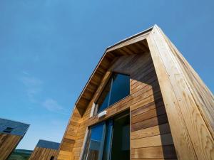 a wooden facade of a house with a window at Bothy 1 - Uk50471 in Greenhaugh +2 photos