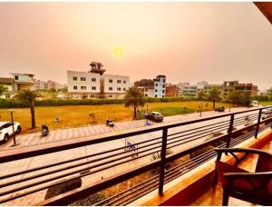 a view of a city from a balcony at Brijwasi Bhavan vrindavan Omax in Chhatikara +4 photos