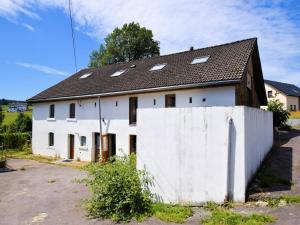 a white house with a black roof at Modern Holiday Home in Meyerode with Terrace in Meyerode