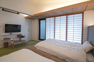 Postel nebo postele na pokoji v ubytování KyotoGosyonishi - Vacation STAY 23016v