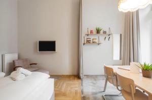 Postel nebo postele na pokoji v ubytování grätzlhotel Karmelitermarkt