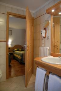 Postel nebo postele na pokoji v ubytování Hotel Sport