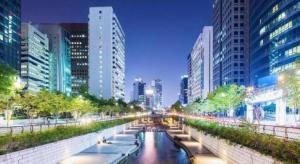a river in the middle of a city with buildings at Novalus Tourist Hotel in Seoul