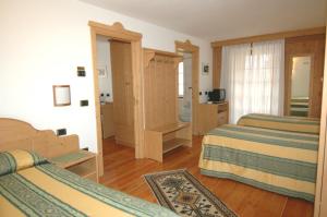 Postel nebo postele na pokoji v ubytování Hotel Sport