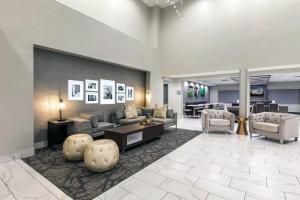 a lobby with couches and chairs and a table at Wingate Augusta Washington Road by Wyndham in Augusta