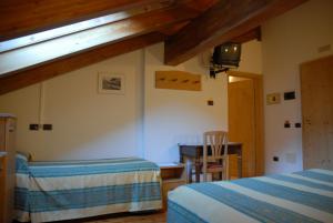 Postel nebo postele na pokoji v ubytování Hotel Sport