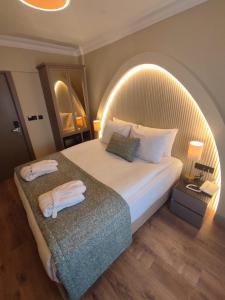 a hotel room with a bed with an arched ceiling at Mara Oldcity Hotel in Istanbul