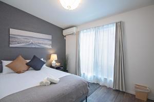Ένα ή περισσότερα κρεβάτια σε δωμάτιο στο Osaka - House - Vacation STAY 16270