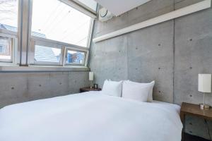 Postel nebo postele na pokoji v ubytování Full Circle Apartments