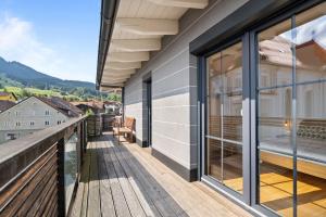 a balcony with a view of the mountains at Sunset Club - Nesselwang Chalets Nr 1 in Nesselwang